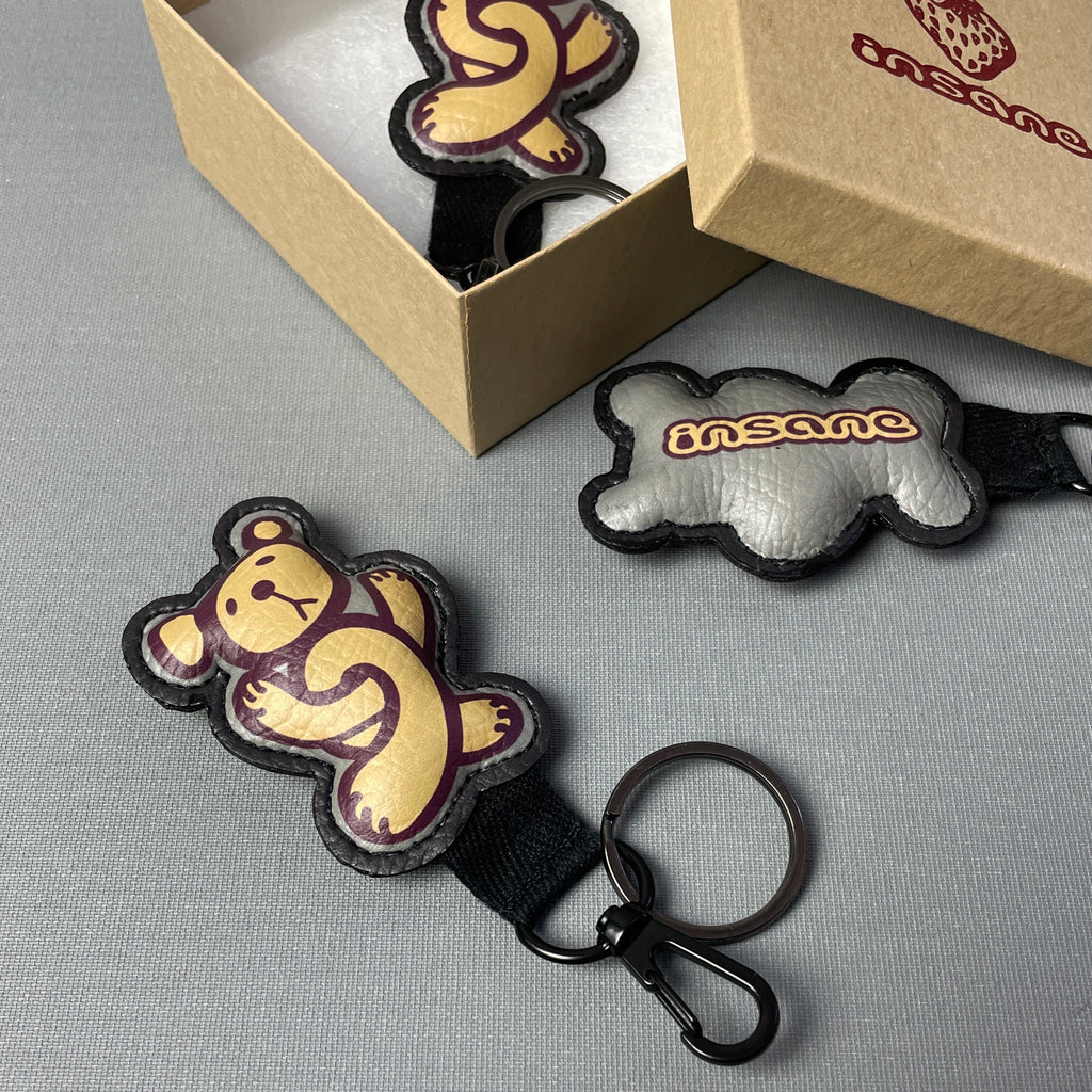 This picture shows an Insane Twisted Teddy vegan leather key ring and presentation gift box.