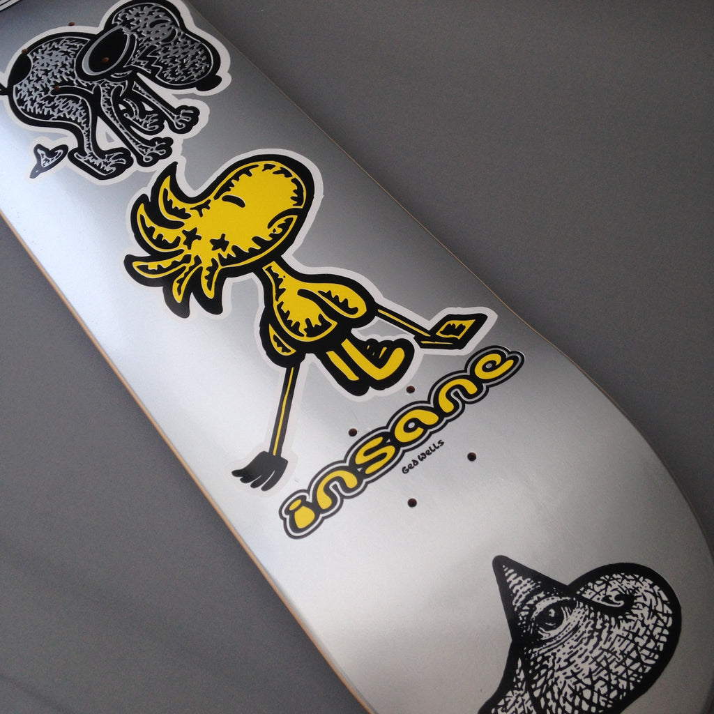 A skateboard deck featuring Ged Well's interpretation of the classic Snoopy and Charlie Brown cartoon characters